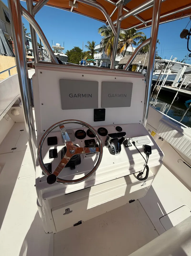 Slide: The Image of Helm of a 2000 Intrepid 356 boat featuring Garmin electronics. - 7