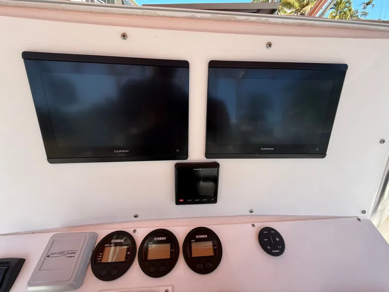 Slide: The Image of Boat dashboard with Garmin screens and Yamaha instruments, Intrepid 356, year 2000. - 8