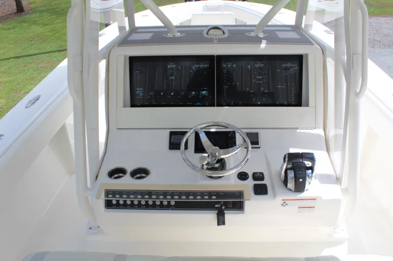 Slide: The Image of 2022 SeaVee 370Z boat console with dual screens and modern controls. - 11