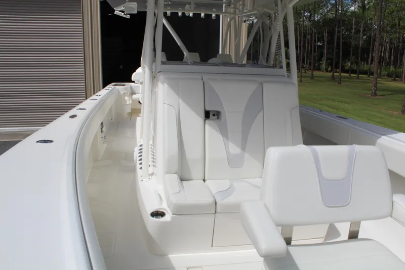 Slide: The Image of 2022 SeaVee 370Z boat interior with white seating and sleek design. - 14