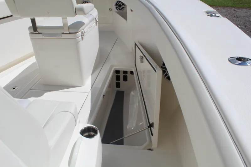 Slide: The Image of 2022 SeaVee 370Z boat interior with open storage compartment and seating area. - 22
