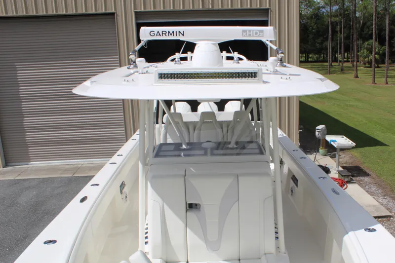 Slide: The Image of 2022 SeaVee 370Z boat with Garmin radar, docked near a garage. - 23