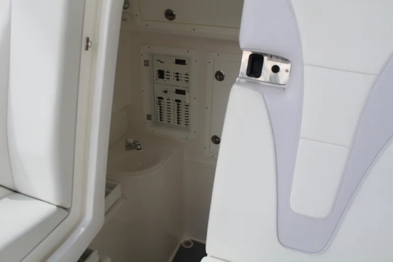 Slide: The Image of 2022 SeaVee 370Z interior with control panel and sink, showcasing modern design. - 26