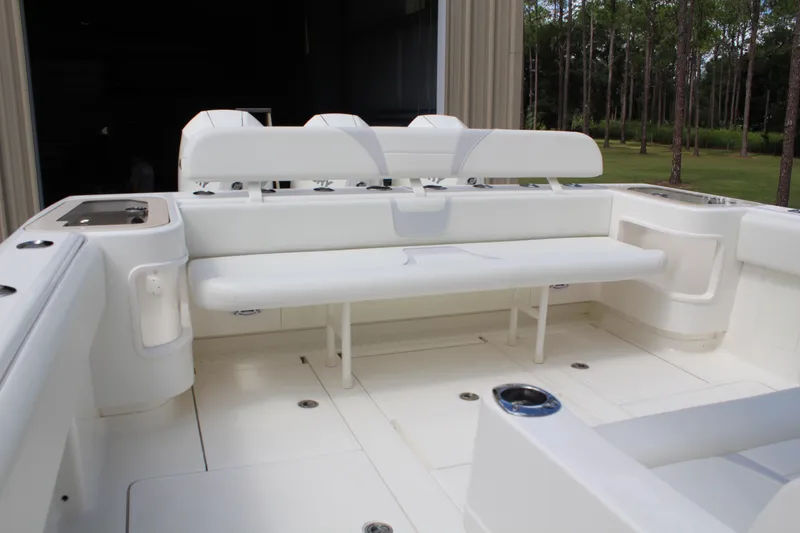 Slide: The Image of 2022 SeaVee 370Z boat interior with white seating and spacious deck. - 28