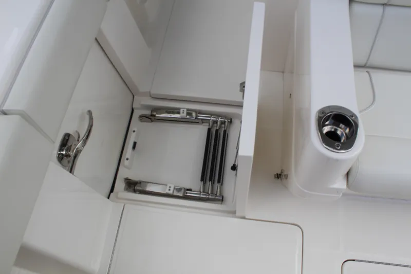 Slide: The Image of 2022 SeaVee 370Z boat interior with storage compartment and stainless steel fittings. - 33