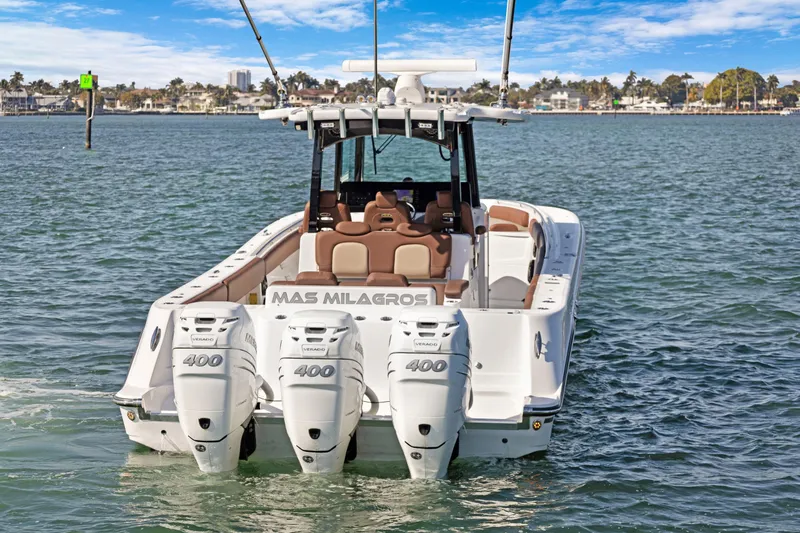 Slide: The Image of 2023 HCB Speciale boat with triple 400 horsepower engines on the water. - 1