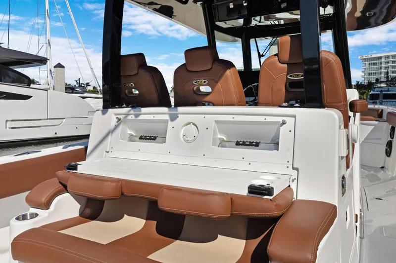 Slide: The Image of 2023 HCB Speciale boat interior with brown leather seating and modern console design. - 15