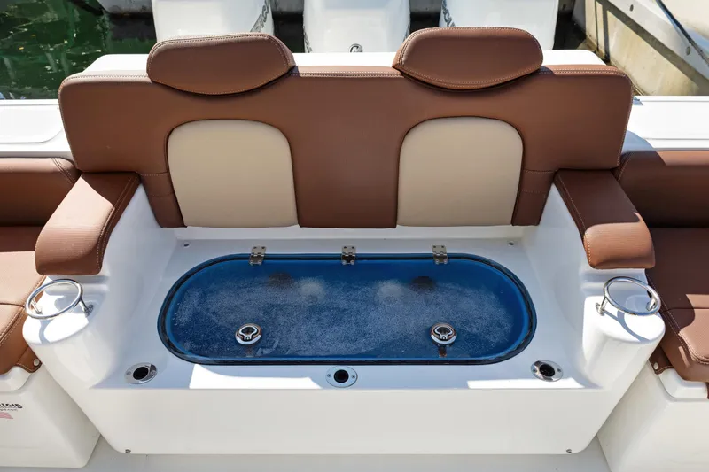 Slide: The Image of 2023 HCB Speciale boat seating with integrated livewell and cup holders. - 19