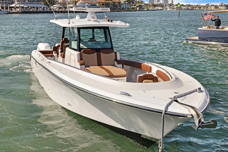 Slide: The Image of 2023 HCB Speciale boat on water, featuring sleek design and luxurious seating. - 2