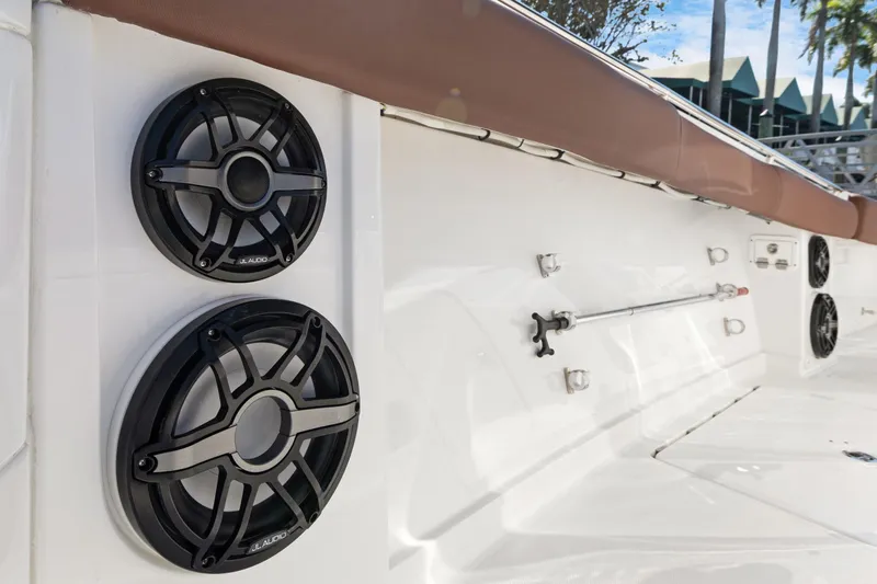 Slide: The Image of 2023 HCB Speciale boat with JL Audio speakers on deck, featuring sleek white design. - 20