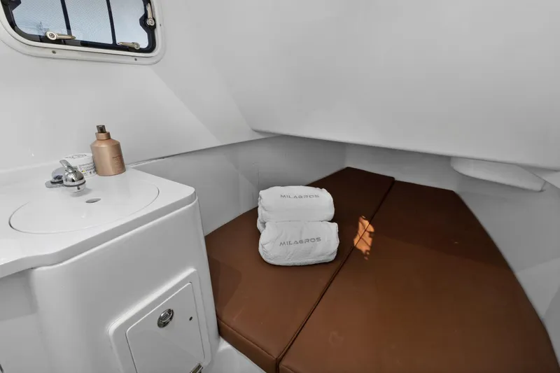 Slide: The Image of 2023 HCB Speciale cabin interior with sink, brown cushions, and folded towels. - 22