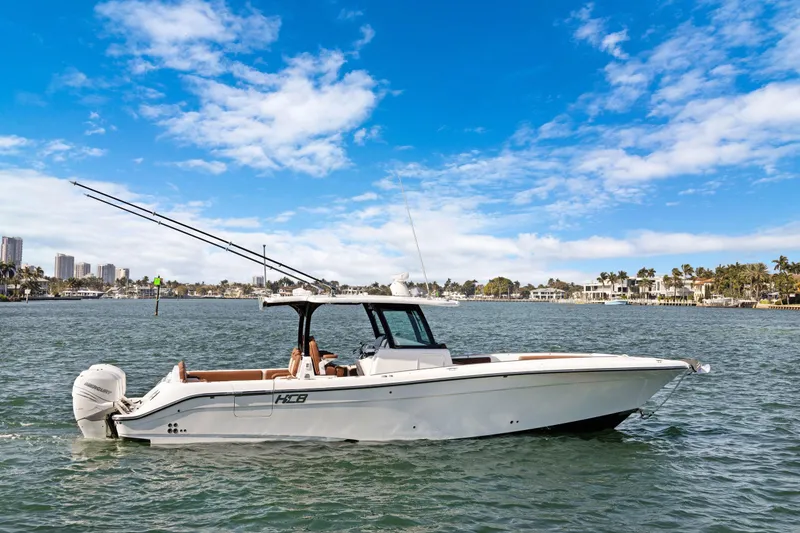 Slide: The Image of 2023 HCB Speciale boat on water with clear blue sky background. - 25