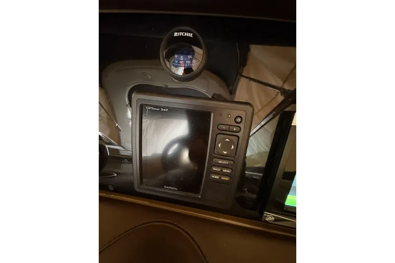 Slide: The Image of 2016 Formula 310 Bowrider dashboard with Garmin GPSMAP 547 and Ritchie compass. - 11