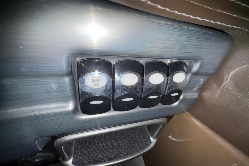 Slide: The Image of Control panel with switches on a 2016 Formula 310 Bowrider boat. - 17