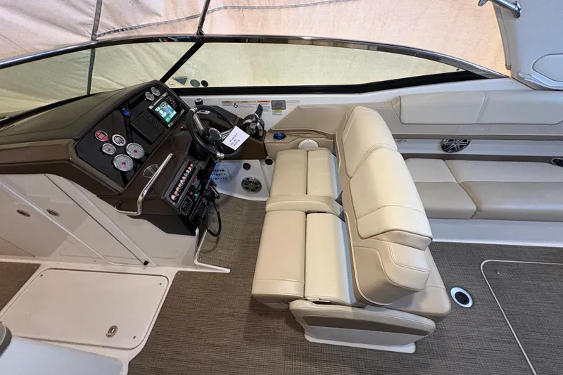 Slide: The Image of 2016 Formula 310 Bowrider interior with beige seating and modern dashboard controls. - 19