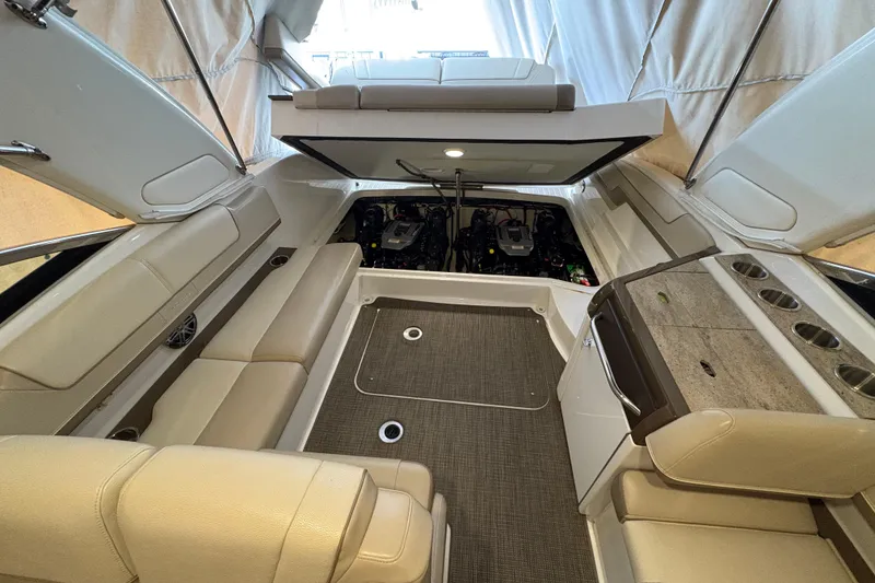 Slide: The Image of 2016 Formula 310 Bowrider interior with seating and engine compartment. - 20