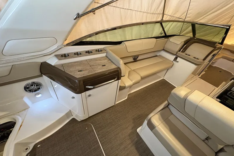 Slide: The Image of 2016 Formula 310 Bowrider interior with beige seating and modern design. - 21
