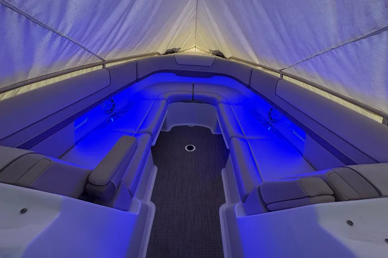 Slide: The Image of 2016 Formula 310 Bowrider interior with blue LED lighting and spacious seating. - 28