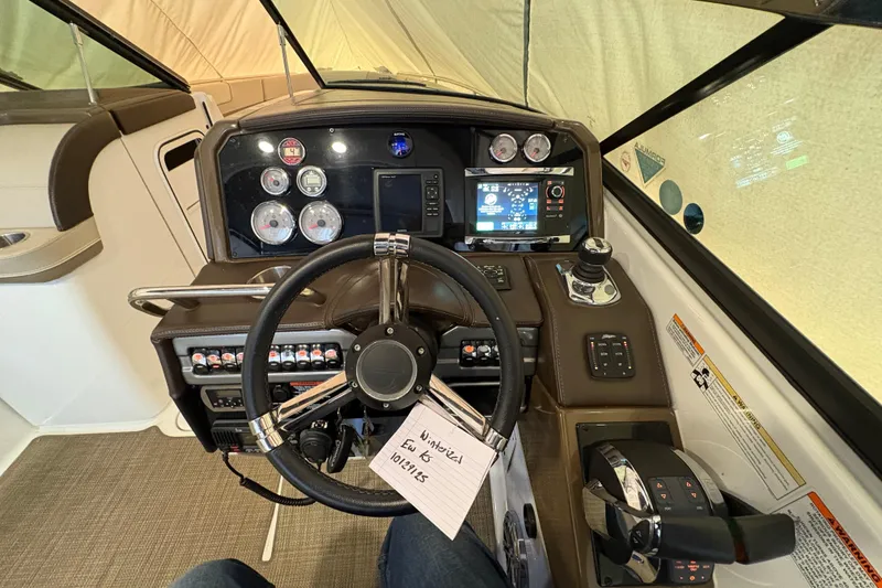 Slide: The Image of 2016 Formula 310 Bowrider dashboard with steering wheel, gauges, and control panel. - 3