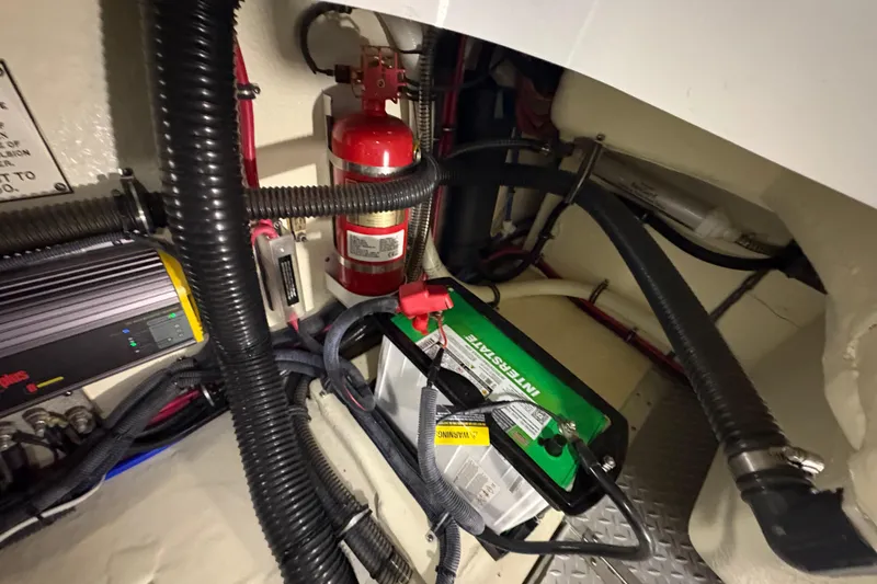 Slide: The Image of Engine compartment of 2016 Formula 310 Bowrider with battery and fire extinguisher. - 34