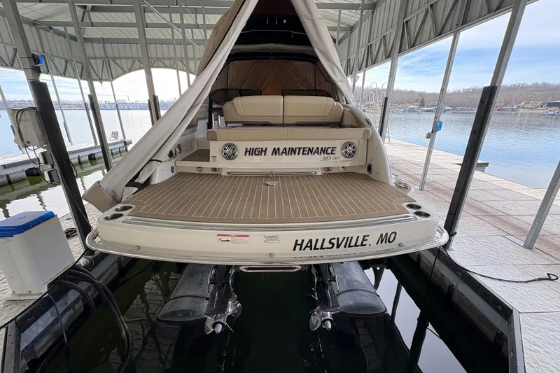 Slide: The Image of 2016 Formula 310 Bowrider docked, rear view, labeled "High Maintenance," Hallsville, MO. - 4