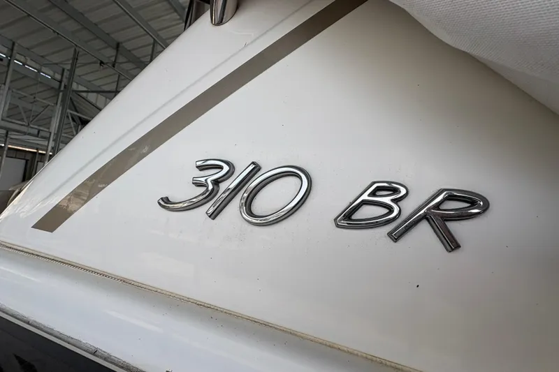 Slide: The Image of 2016 Formula 310 Bowrider boat emblem in a covered storage area. - 44