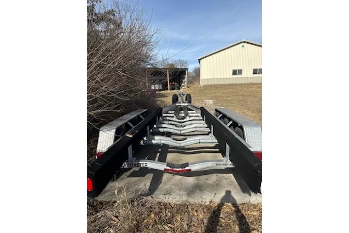 Slide: The Image of Trailer for 2016 Formula 310 Bowrider parked outdoors near a building. - 6