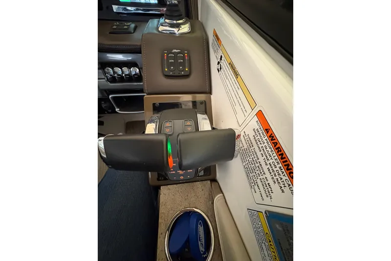 Slide: The Image of 2016 Formula 310 Bowrider control panel with throttle and warning labels. - 8