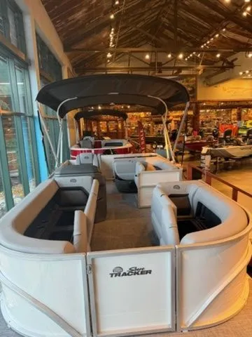 Slide: The Image of Sun Tracker PB 18 pontoon boat 2026 in a showroom. - 7
