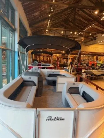 Slide: The Image of 2026 Sun Tracker PB 18 pontoon boat in showroom. - 8