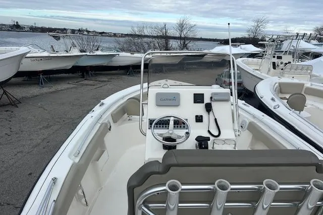 Slide: The Image of 2021 Key West 239 FS boat with Garmin navigation, docked near a waterfront. - 10