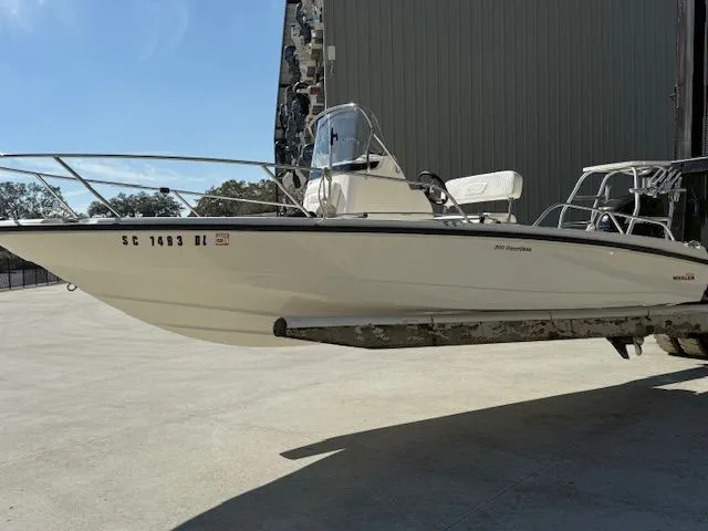 Slide: The Image of 2008 Boston Whaler 200 Dauntless boat on a trailer. - 1