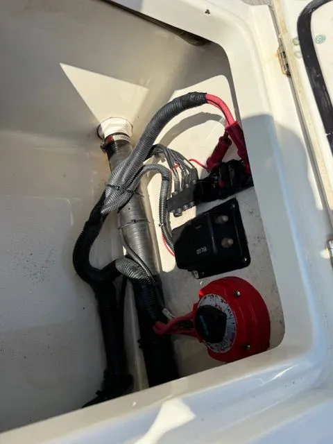 Slide: The Image of Electrical setup in storage compartment of 2008 Boston Whaler 200 Dauntless. - 15