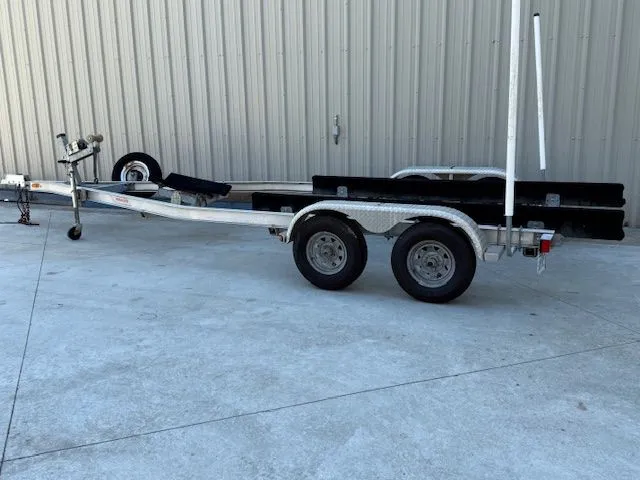 Slide: The Image of Boat trailer for 2008 Boston Whaler 200 Dauntless on concrete surface. - 17