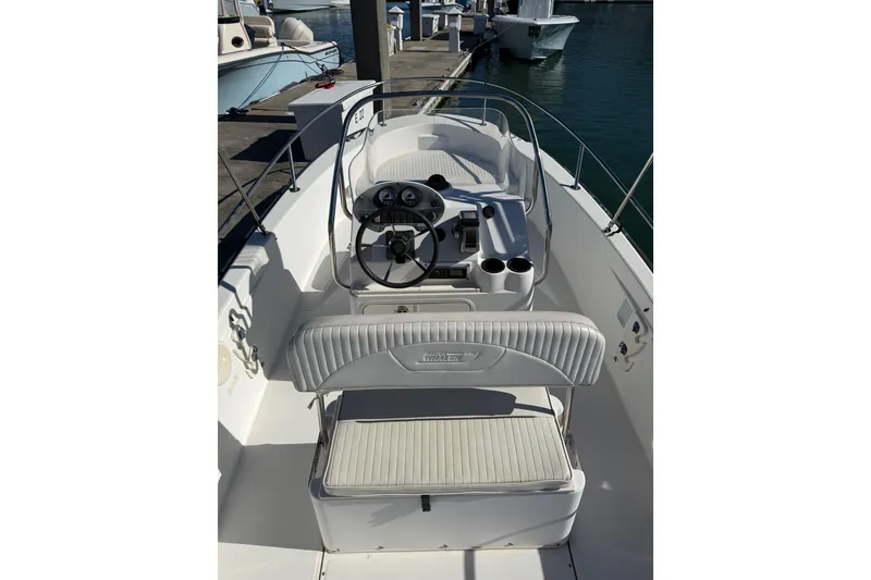 Slide: The Image of 2006 Boston Whaler 180 Dauntless boat interior with steering console and seating. - 6