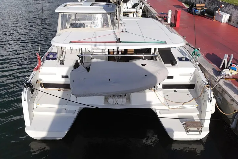 Slide: The Image of 2020 Lagoon 42 catamaran docked at marina, rear view. - 15