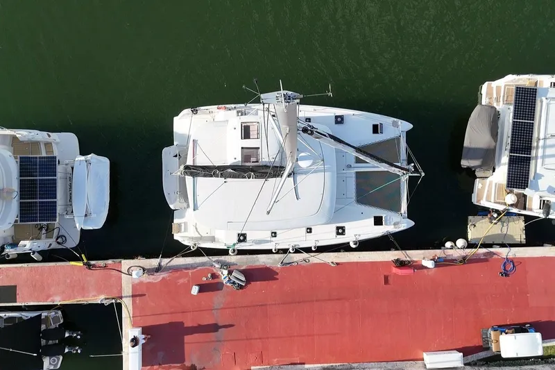 Slide: The Image of Aerial view of a 2020 Lagoon 42 catamaran docked at a marina. - 18