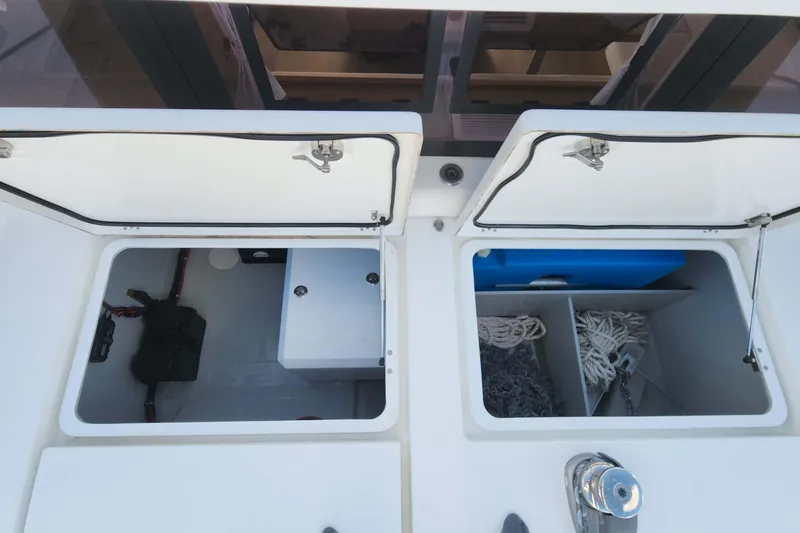 Slide: The Image of Storage compartments on a 2020 Lagoon 42 catamaran, featuring organized space and equipment. - 22