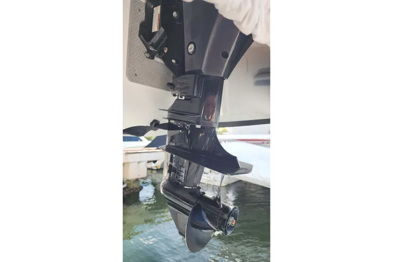 Slide: The Image of Close-up of a 2020 Lagoon 42 boat's outboard motor in a marina setting. - 30