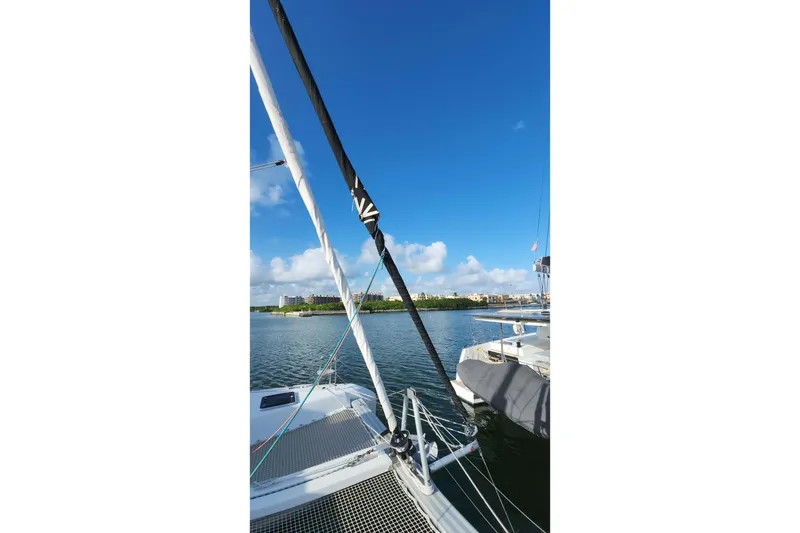 Slide: The Image of Sailing on a 2020 Lagoon 42 catamaran with clear blue skies and calm waters. - 32