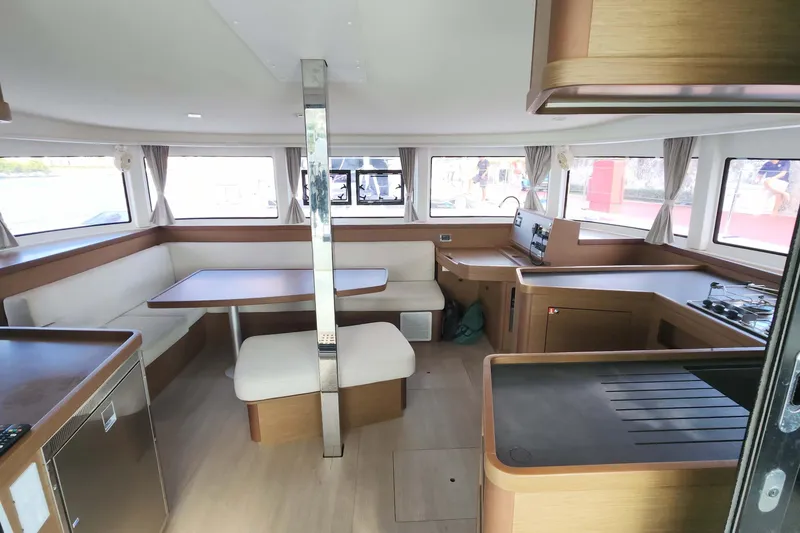 Slide: The Image of Interior of 2020 Lagoon 42 catamaran with modern kitchen and dining area. - 33
