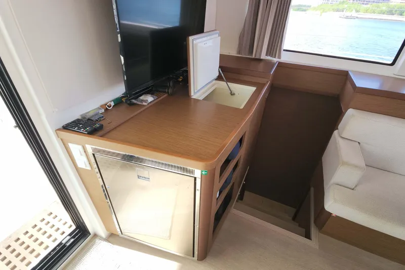 Slide: The Image of Interior of 2020 Lagoon 42 yacht with kitchenette and seating area. - 35