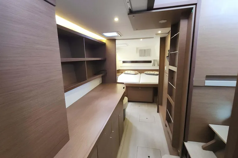 Slide: The Image of Luxurious interior of 2020 Lagoon 42 catamaran with modern wood finish and cozy bedroom. - 40