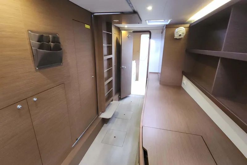 Slide: The Image of Interior of 2020 Lagoon 42 yacht, featuring wooden cabinetry and modern design elements. - 43