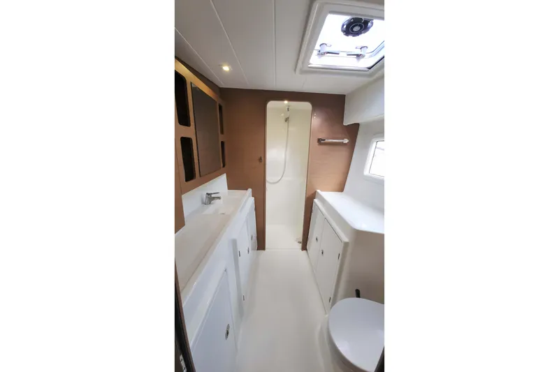 Slide: The Image of Modern bathroom interior of 2020 Lagoon 42 yacht, featuring sleek design and ample lighting. - 44