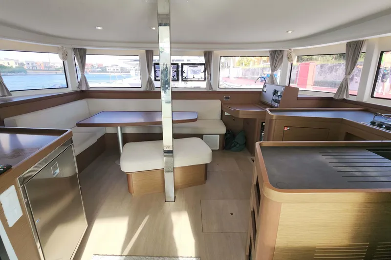 Slide: The Image of Modern interior of 2020 Lagoon 42 catamaran with spacious seating and panoramic windows. - 49