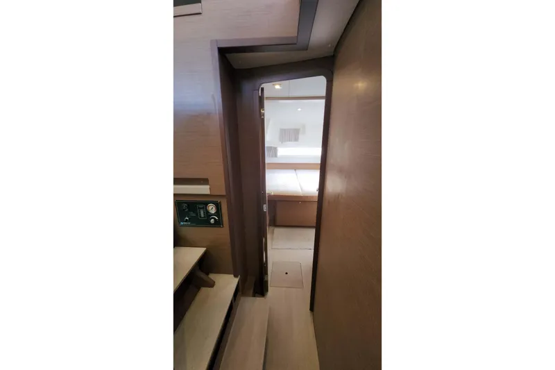 Slide: The Image of Interior view of 2020 Lagoon 42 yacht cabin with wooden finish. - 53