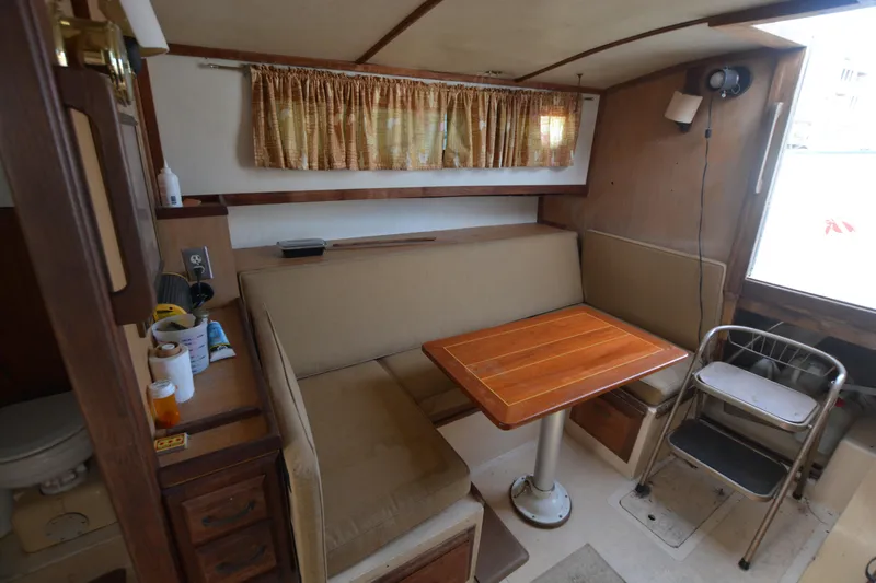 Slide: The Image of 1974 Fales Navigator interior with cozy dining area and wooden table. - 20