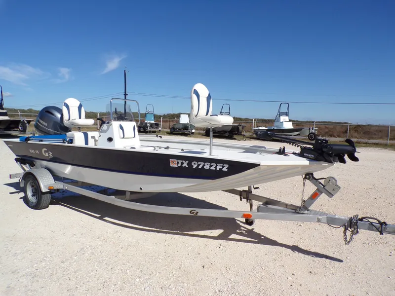 Slide: The Image of 2018 G3 Bay 18 boat on trailer under sunny skies. - 11