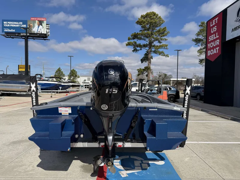 The Image of Xpress SW20B 2026 boat with 115 HP motor in parking lot. - 8